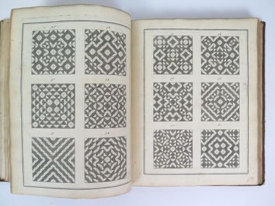 a book with a pattern on it sitting on a table