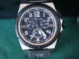 a close up of a watch on a table