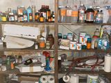 many bottles and cans on the shelves in the room
