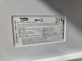 a close up of the back of a white refrigerator