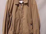 an image of a jacket hanging on a hanger on a wall