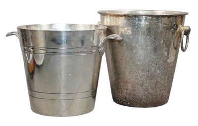 two metal buckets sitting next to each other on a white surface