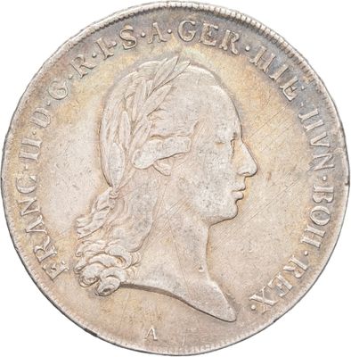 gros plan d'une pièce de monnaie sur laquelle figure une tête de femme