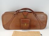 brown leather case with a tan cloth and a brown bag