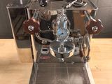 a coffee machine that is sitting on a wooden table