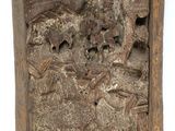 a close up of a piece of wood with a picture of a man on a horse