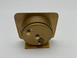 a small metal object on a white surface