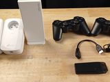 two wii controllers and a charger on a table