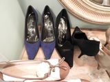 several pairs of women ' s shoes are lined up next to a mirror