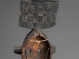 an image of a sculpture of a head with horns on top of it