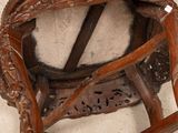 a wooden chair that has a seat made of wood
