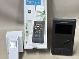 a box with a remote control and a box with a phone in it