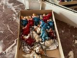 a box of christmas ornaments sitting on a table