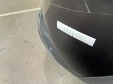 a sticker on the back of a motorcycle that is parked in a parking lot