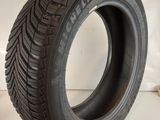 a close up of a tire on a white surface