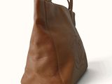 a brown handbag with a brown handle on a white background
