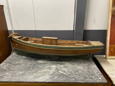 a wooden boat sitting on top of a table