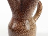 a brown vase with a handle on a white background