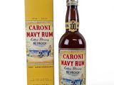 a bottle of caroni navy rum next to a box
