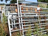 a fence that has a bunch of cattle inside of it