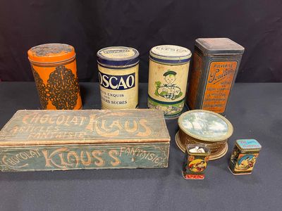 several tins of various types of tins are on a table