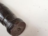 a small metal object on a table with a keychain on it
