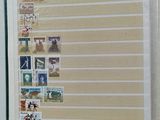 an open book with stamps on it sitting on a table
