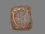 an old iron plate with a design on it
