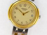 an image of a close up of a wrist watch on a white surface
