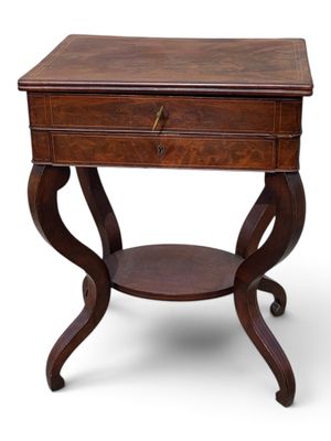 a small wooden table with a drawer on top of it