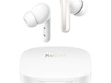 a pair of white earphones sitting on top of a white box