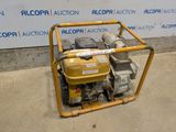 an image of a small pump sitting on top of a cement floor