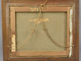 an old picture frame with a picture of a bird on it