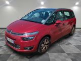 a red citrole parked on a checkered floor in a garage