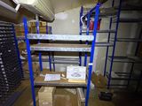 a room with shelves and boxes on the floor