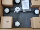 a cardboard box with a bunch of white balls inside of it