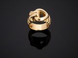 a gold ring on a black surface
