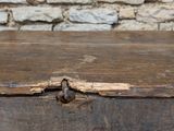 a wooden box that has a latch on it