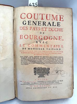 an open book with a picture of a man in a tuxedo on it