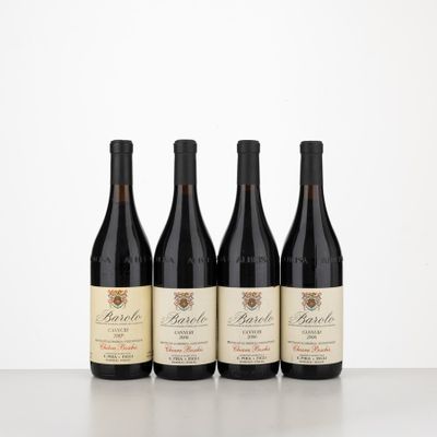 three bottles of wine are lined up on a table