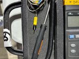 a black case with a digital thermometer in it