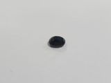 an oval black diamond on a white surface
