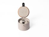 concrete ring box with a wooden lid on a white background