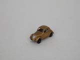 a small toy car that is sitting on a white surface