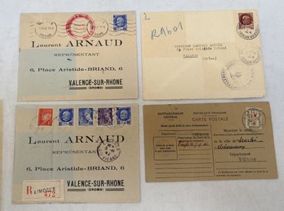 several different types of stamps and envelopes are displayed on a table