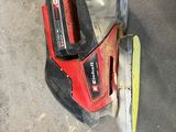 a picture of a cordless sander and a sander on the ground