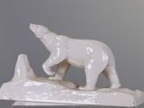 a statue of a polar bear on top of a rock
