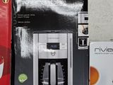 two boxes of coffee machines on a shelf next to each other
