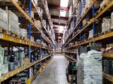 a large warehouse filled with lots of boxes and pallets