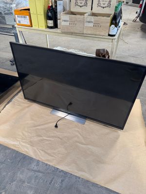 a large flat screen tv sitting on top of a table